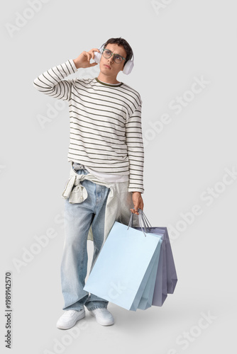 Stylish young man in headph...