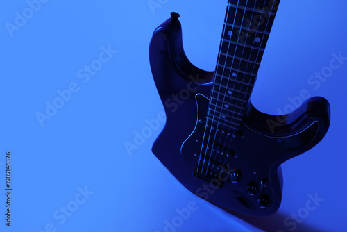 Modern electric guitar on b...