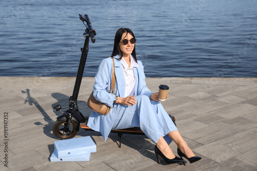 Young businesswoman with co...