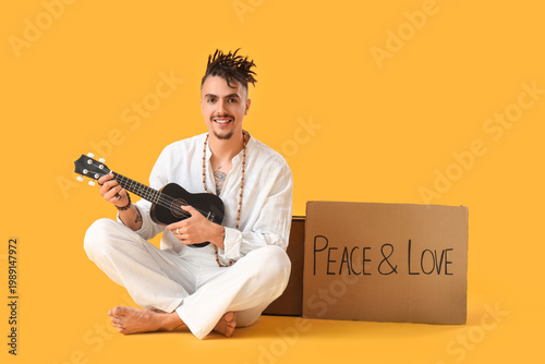 Male hippie with cardboard ...