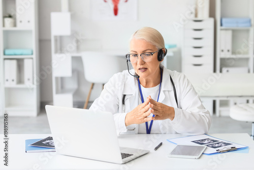 Female doctor with headset ...