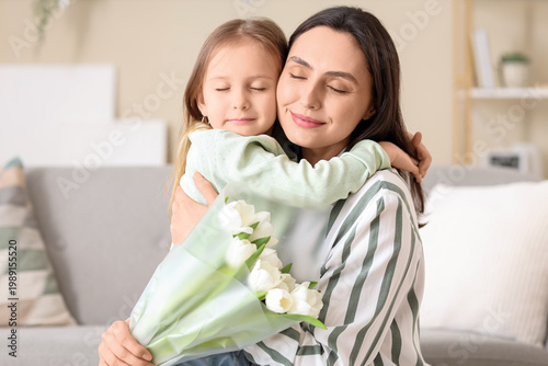 Cute little girl hugging he...
