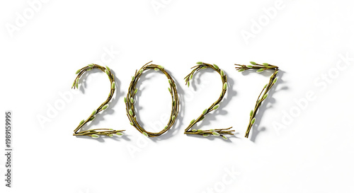 Golden twigs forming 2027 on white background, branches