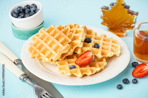 Plate of tasty waffles with...