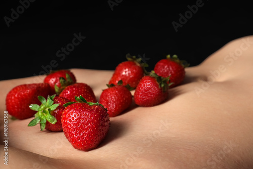 Naked young woman with stra...
