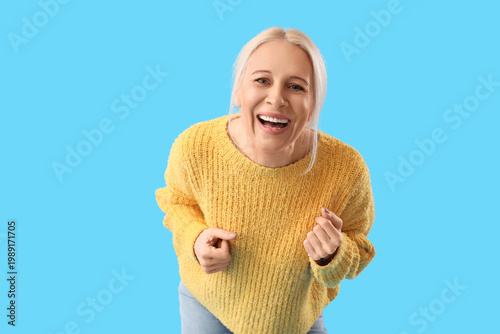 Mature woman laughing on bl...