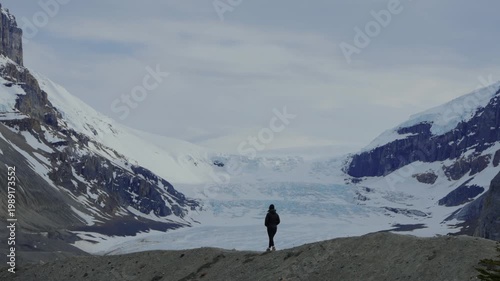 Woman hiking in Athabasca Glacier in Jasper National Park, Canada