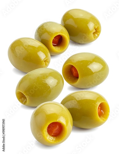 Close-up of pitted green olives stuffed with red pimiento on white