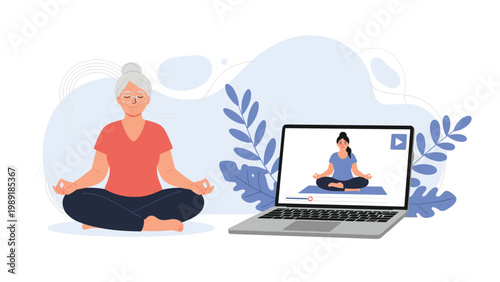 Healthy senior woman with gray hair practicing yoga in a seated meditation pose while following a video lesson on a laptop at home.