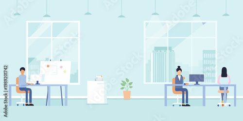 Modern office space with three people working at their desks
