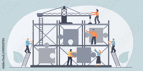 Construction workers assemble a large puzzle shaped structure with a crane