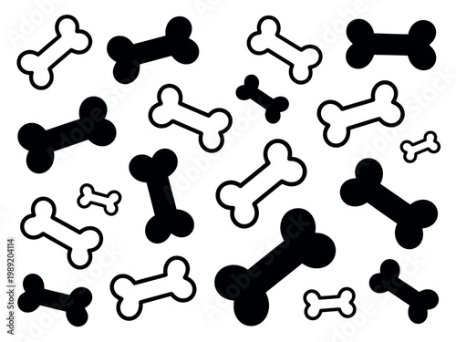 A collection of black and white dog bones on a plain background