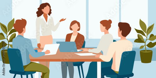 A business meeting in progress with a presenter and attentive team