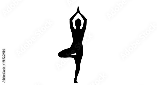 Woman in yoga tree pose standing.