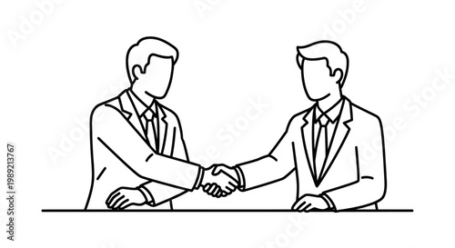 Two businessmen shaking hands symbolizing agreement and partnership.
