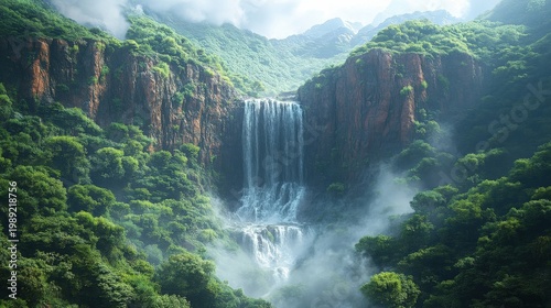 Lush Green Tropical Waterfall Cascading Down Moss Covered Cliffs Amidst Misty Forest Landscape