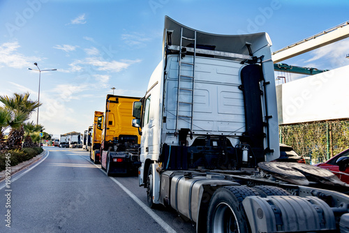 Fotografija Long queue of commercial trucks waiting in line on a highway