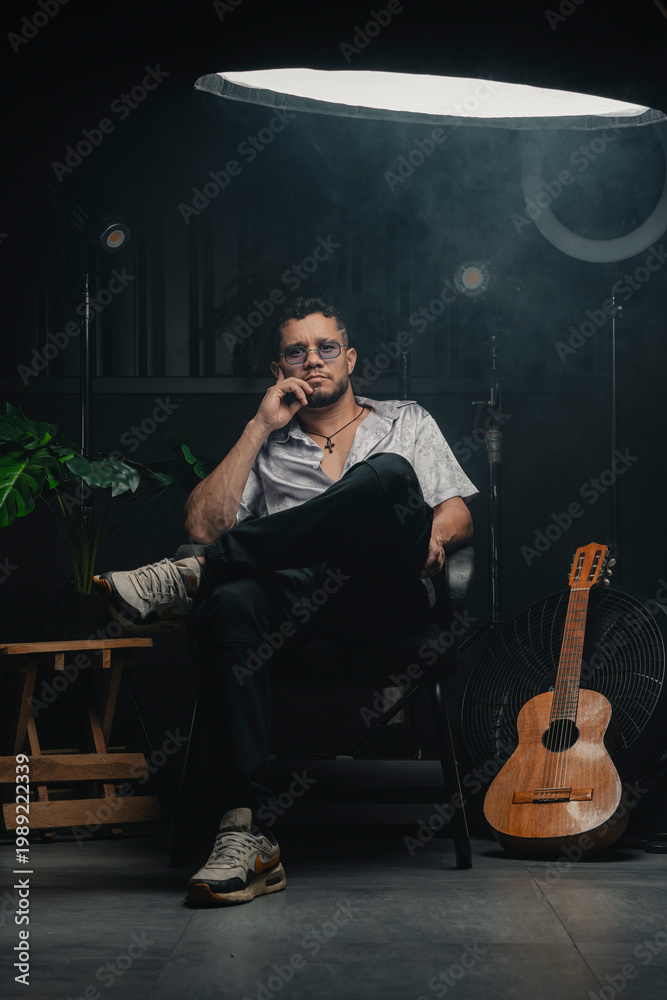 Fototapeta premium Musician sitting in studio contemplating music and creativity