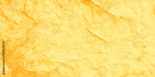 Golden crumpled paper texture background with orange tones and vintage feel for design elements