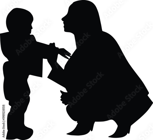 Black silhouette of a mother crouching to help her young child get dressed or put on a jacket representing parental care motherhood and childhood isolated on white background for 