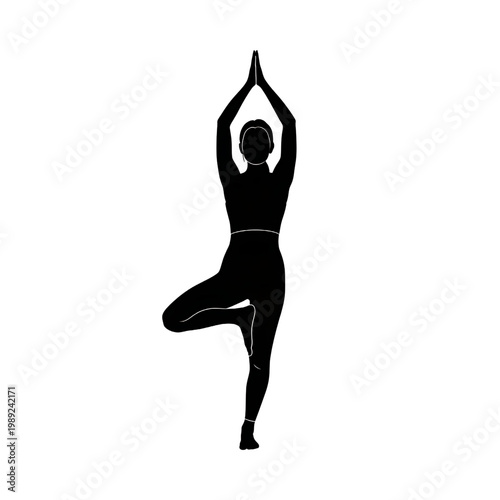 Woman Practicing Yoga in Tree Pose.