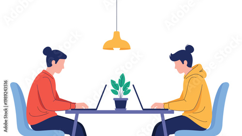 Two students sitting opposite each other at a desk working on their laptops in a quiet minimalist office environment.