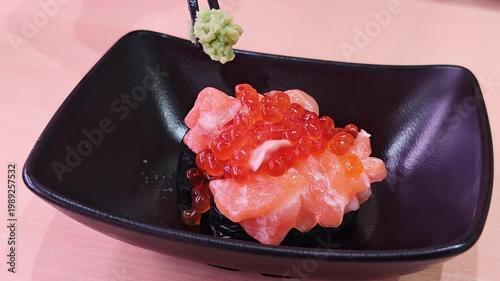 delicious japanese ikura don rice bowl with fresh salmon roe and wasabi