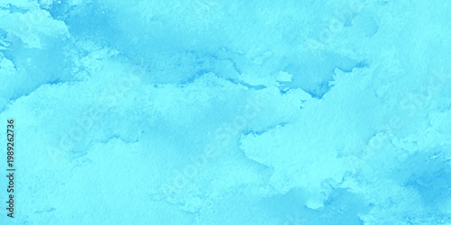 Soft blue watercolor texture background with abstract light blue paint splatters and subtle gradient effect for creative design