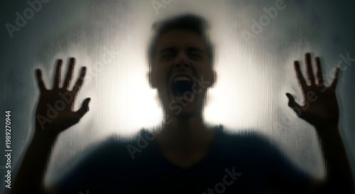Silhouette of a scared man screaming.