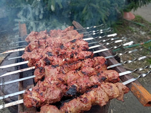 Shish kebab on skewers is cooked in the fresh air.