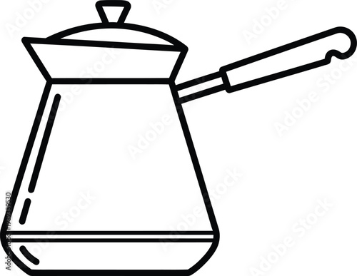 Traditional cezve used for making turkish coffee with its long handle.