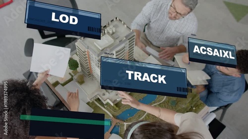 Architects tapping tablet, reviewing model for planning, panels TRACK LOG SLEEP stacking over model