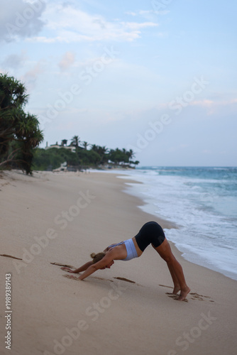 Beach yoga photos. Serene beach scene with balanced woman exuding strength and mental concentration