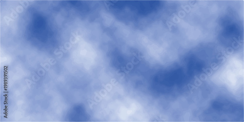 A beautiful blue sky with white clouds creates a bright summer cloudscape as light shines through the air on a clear day