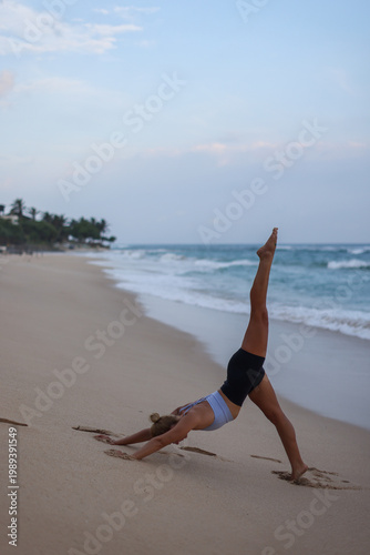 Beach yoga photos. Serene beach scene with balanced woman exuding strength and mental concentration
