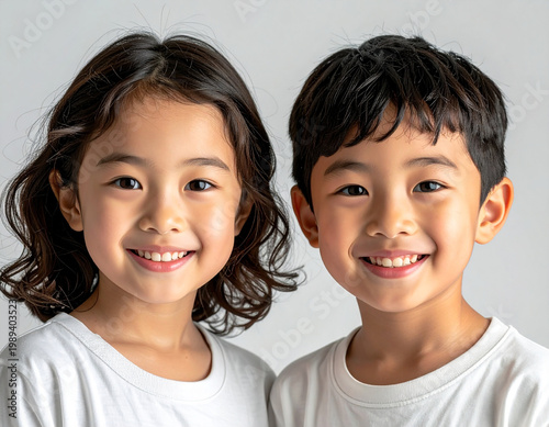  Two smiling children facing camera, happy expression