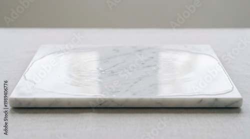 Smooth white marble slab with a thin layer of fragrant oil, soft lighting on texture. travel magazines, destination branding, designed for travel destination branding.