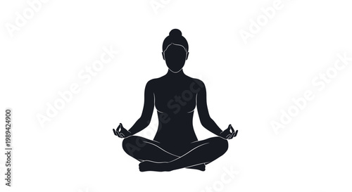 Silhouette of a woman practicing yoga in a meditative lotus position
