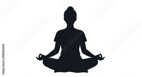 Silhouette of a woman practicing yoga in a meditative pose