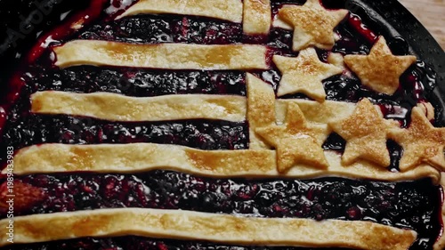 Fruit pie with fat-rich lattice in USA flag pattern, freshly baked and hot