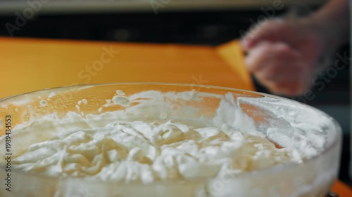 The bowl with well-mixed ice cream ingredients is set aside