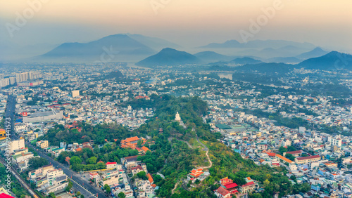 Photos A majestic view of the giant white Buddha statue at Long Son Pagoda, Nha Trang, Vietnam peacefully seated atop a hill overlooking the city