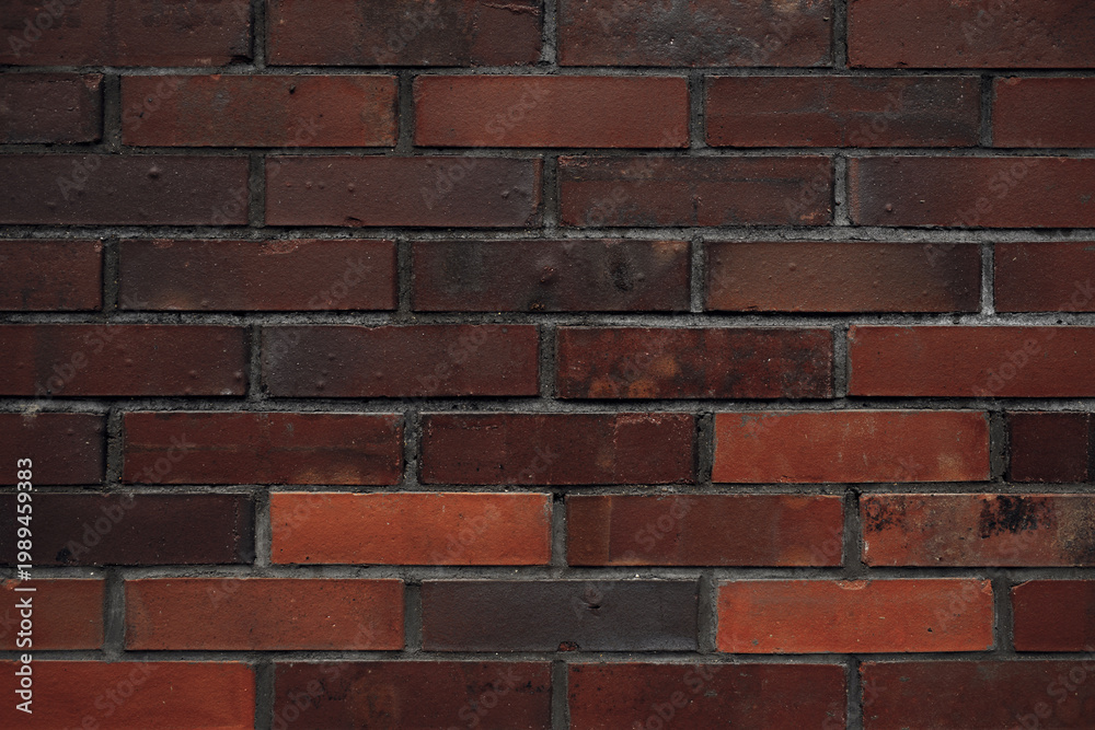 Fototapeta premium Old dark brown brick wall texture. Grunge background