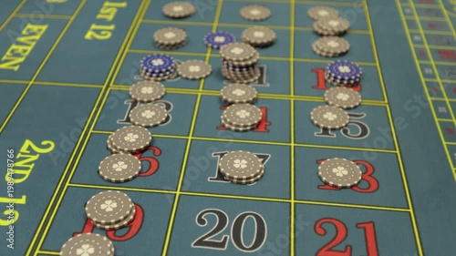 Hands placing bets on roulette table in casino, close up