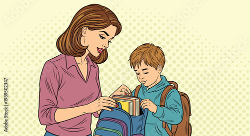 Loving mother helping her young son pack his books into a backpack preparing him for a successful day at school.