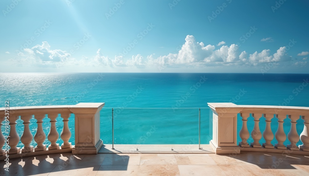 Naklejka premium Balcony with ornate railing overlooks turquoise ocean water and clear blue sky. Sunlight reflects on the sea. Serene seascape with bright clouds. Beautiful panorama.