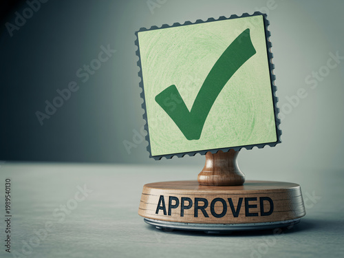 A wooden stamp with a green checkmark on a gray background indicating approval