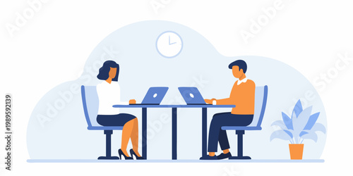 Two professionals collaborating in a modern office setting with laptops