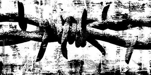 Barbed wire knot stretched over worn textured surface