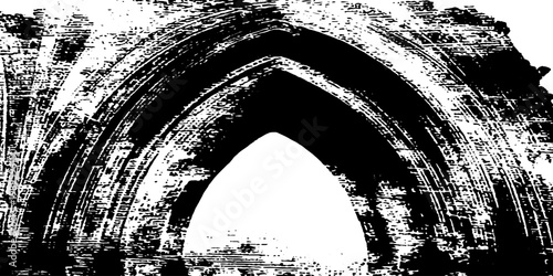 Gothic arch opening silhouetted against bright stone interior